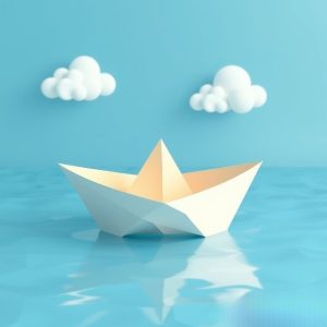 Paper boat on water